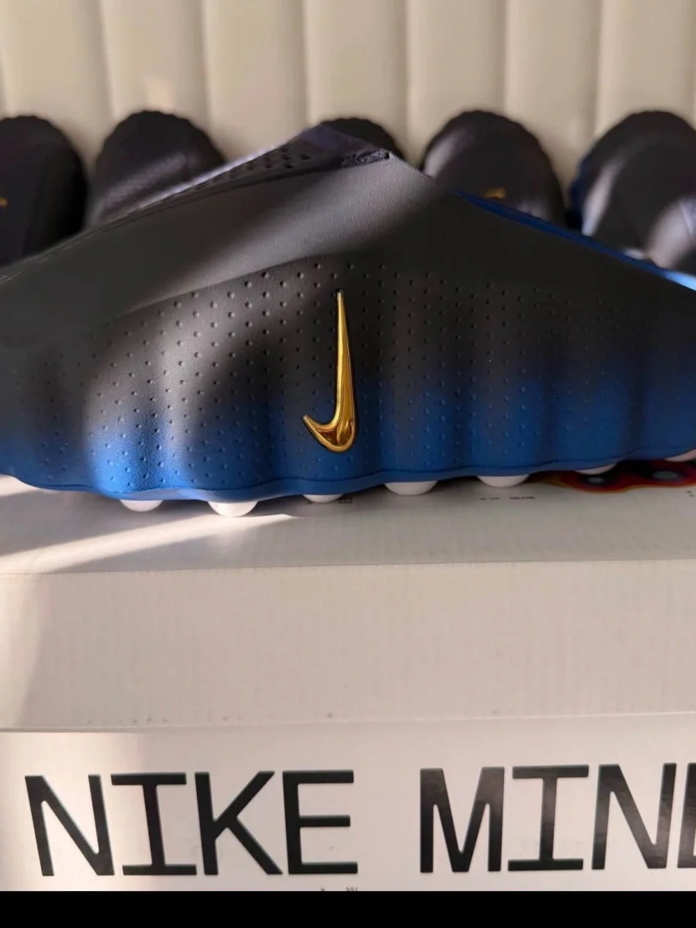 Nike Men's Blue and Black Slide Sandals with Gold Swoosh